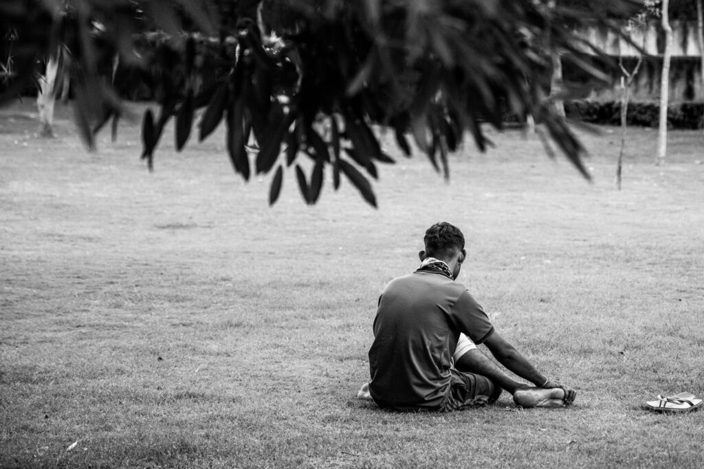 Man looking at loan app approval on phone during financial crisis India — KreditBee Nira GetLoanCredit