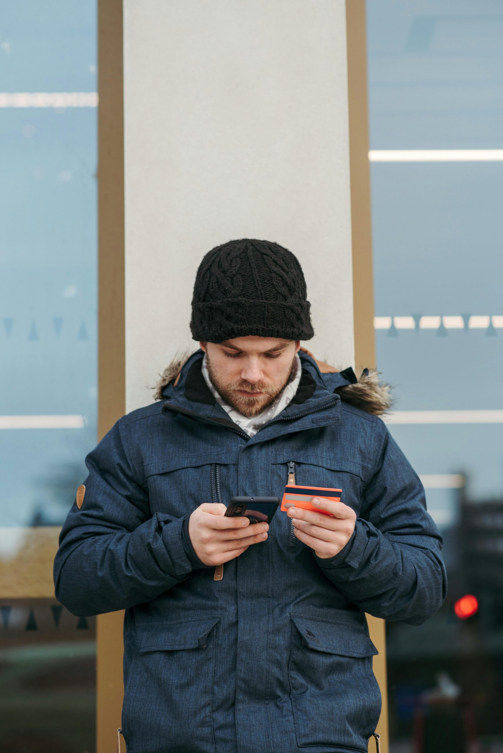 Focused young man calmly using smartphone to apply for instant loan app in India