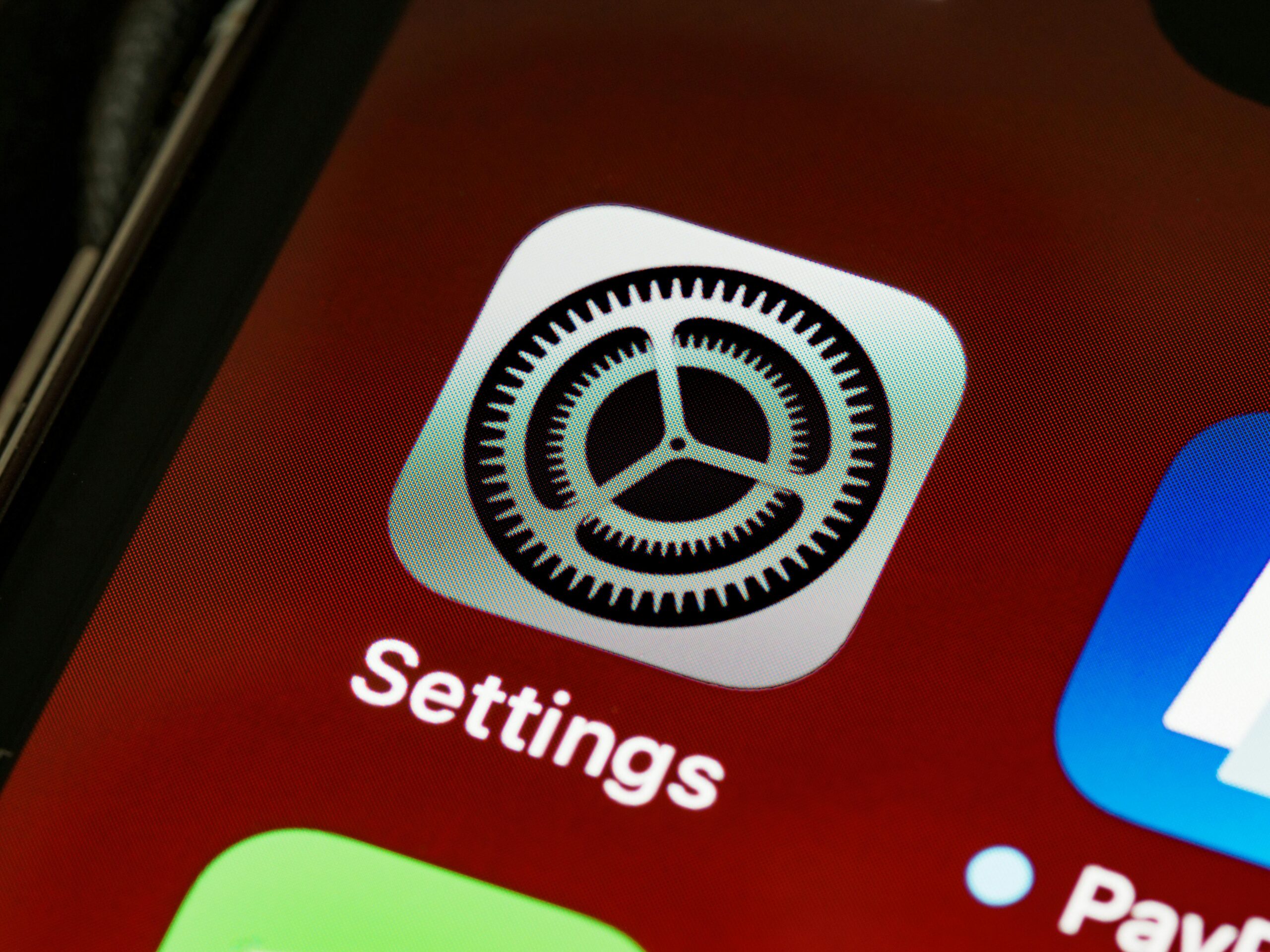 Close-up of smartphone settings screen — checking app permissions before installing a loan app in India